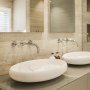 3000 sqft Townhouse - Highgate | Master ensuite - with Dornbracht brassware, corian basins, Milldue vanity unit and riven stone wall cladding | Interior Designers